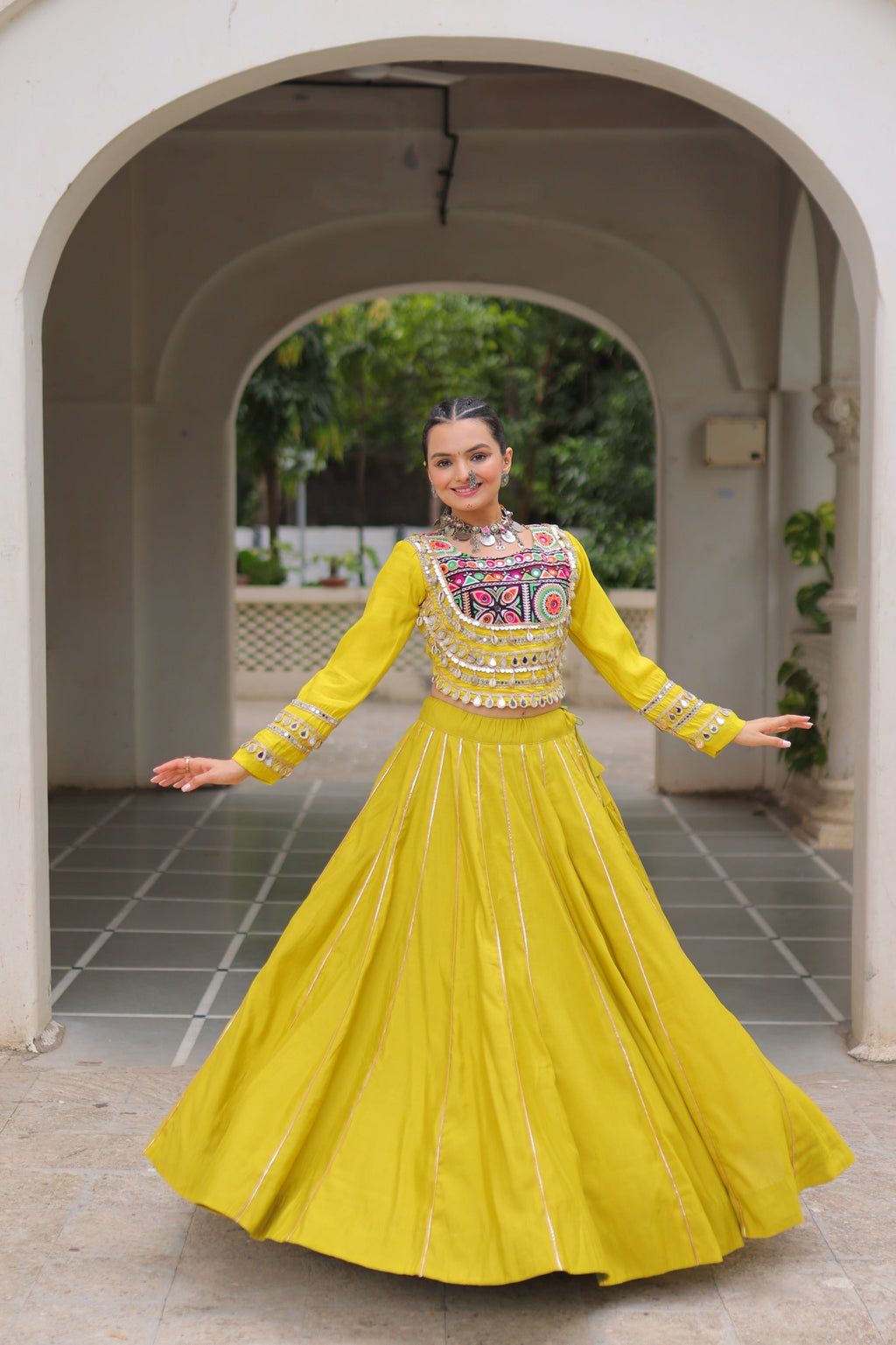 Parrot colored Roman fabric lehenga with Kutchi Gamthi embroidery and Gota-Patti lace for Navratri