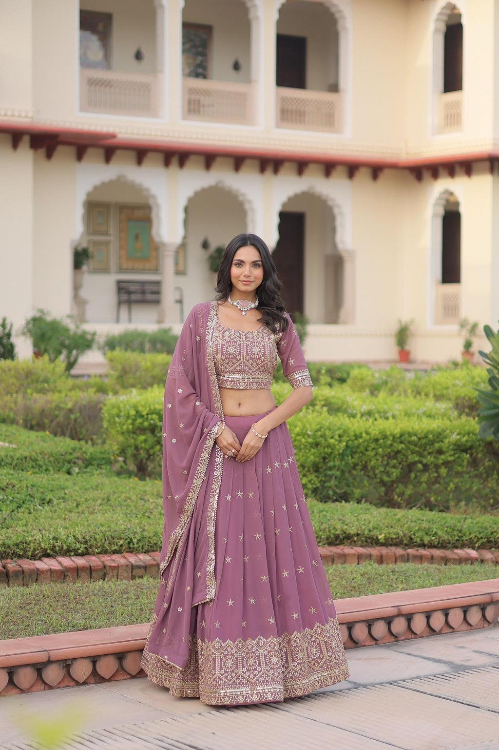 Onion pink faux georgette lehenga with decorative sequins and multi-colored zari embroidery