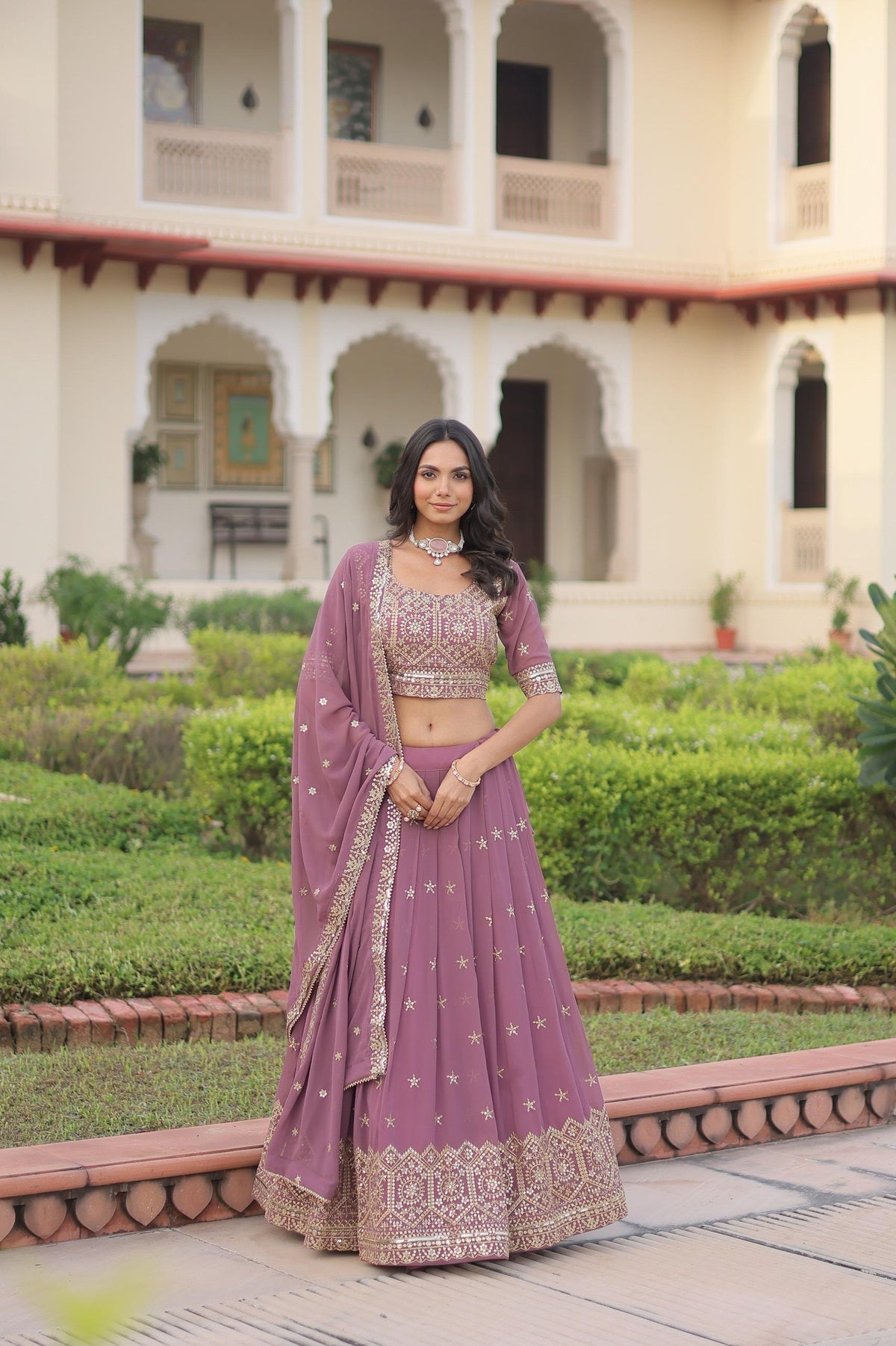 Onion pink faux georgette lehenga with decorative sequins and multi-colored zari embroidery