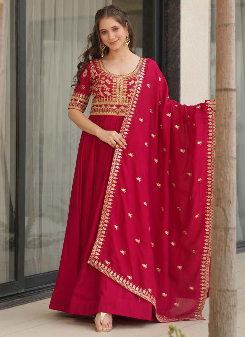 Front view of a floor-length red Vichitra silk gown with detailed sequin and zari embroidery and matching dupatta