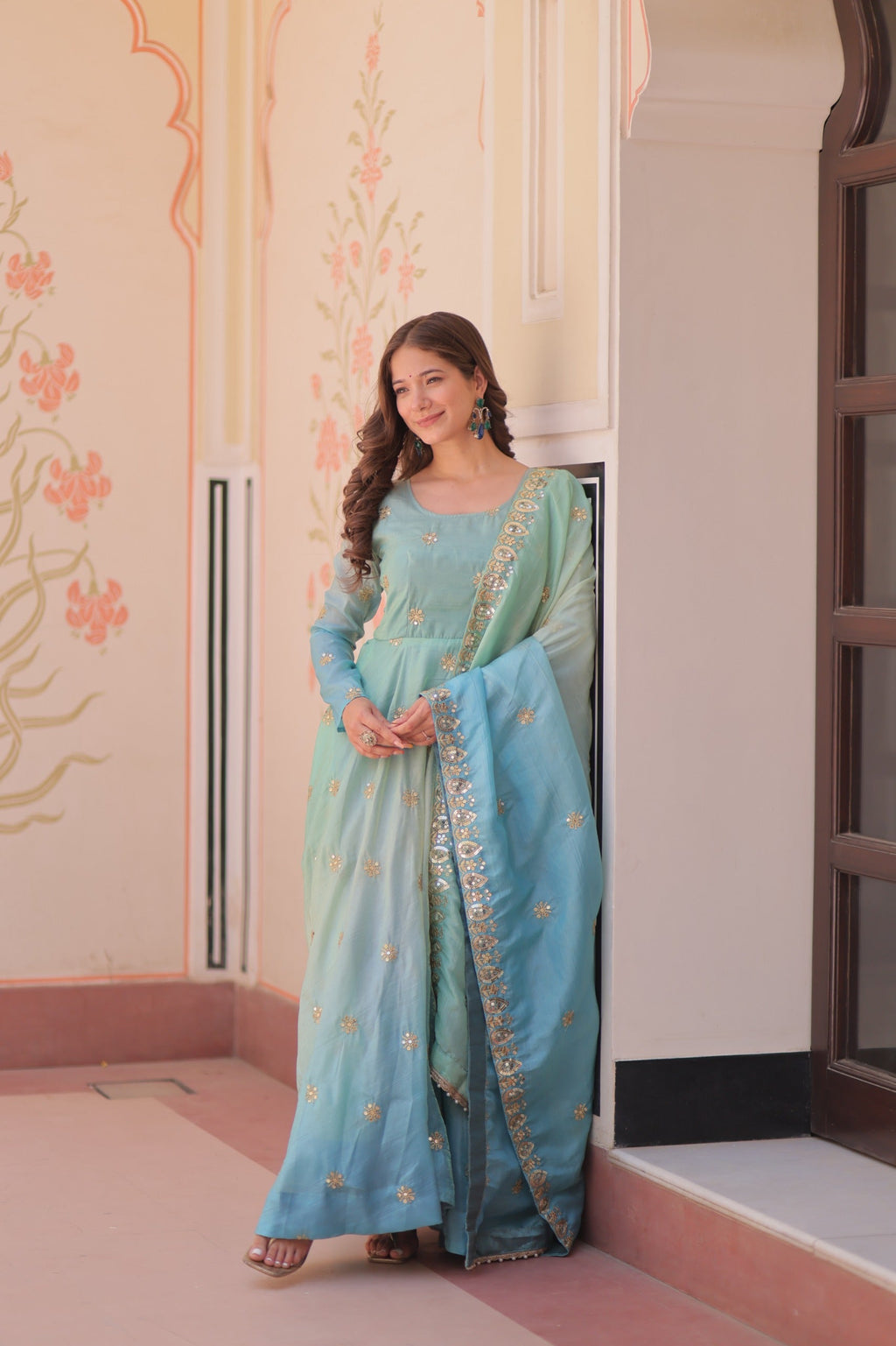 Sky blue organza gown with multi-colored sequins and zari embroidery