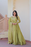 Vibrant parrot green gown in gold-crush fabric with sequins and intricate embroidery