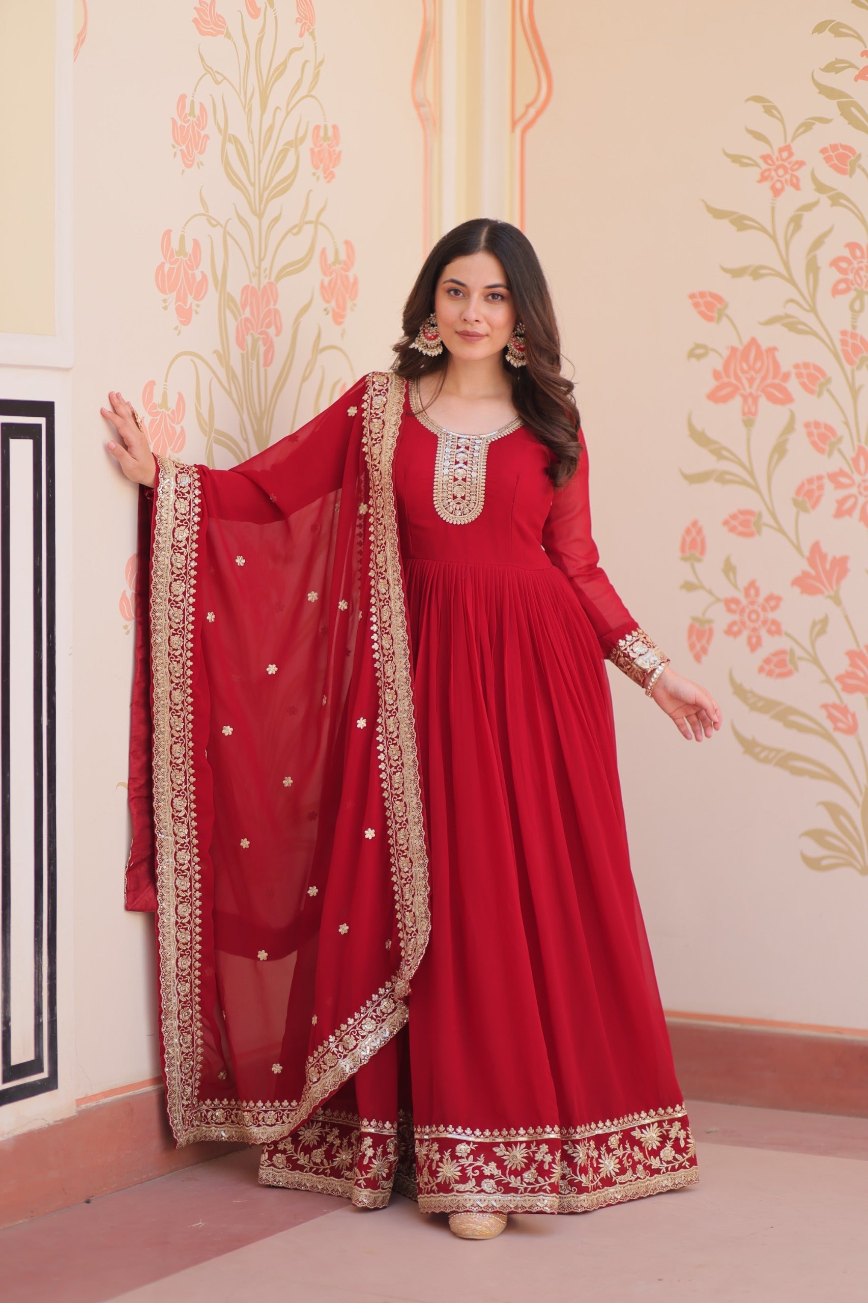 Maroon Faux Blooming Georgette gown adorned with Zari and sequins embroidery