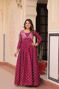 Wine colored gown featuring position print choli style and premium staple jacquard weaving detail.