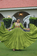 Parrot green rayon gown with intricate Kutchi Gamthi embroidery