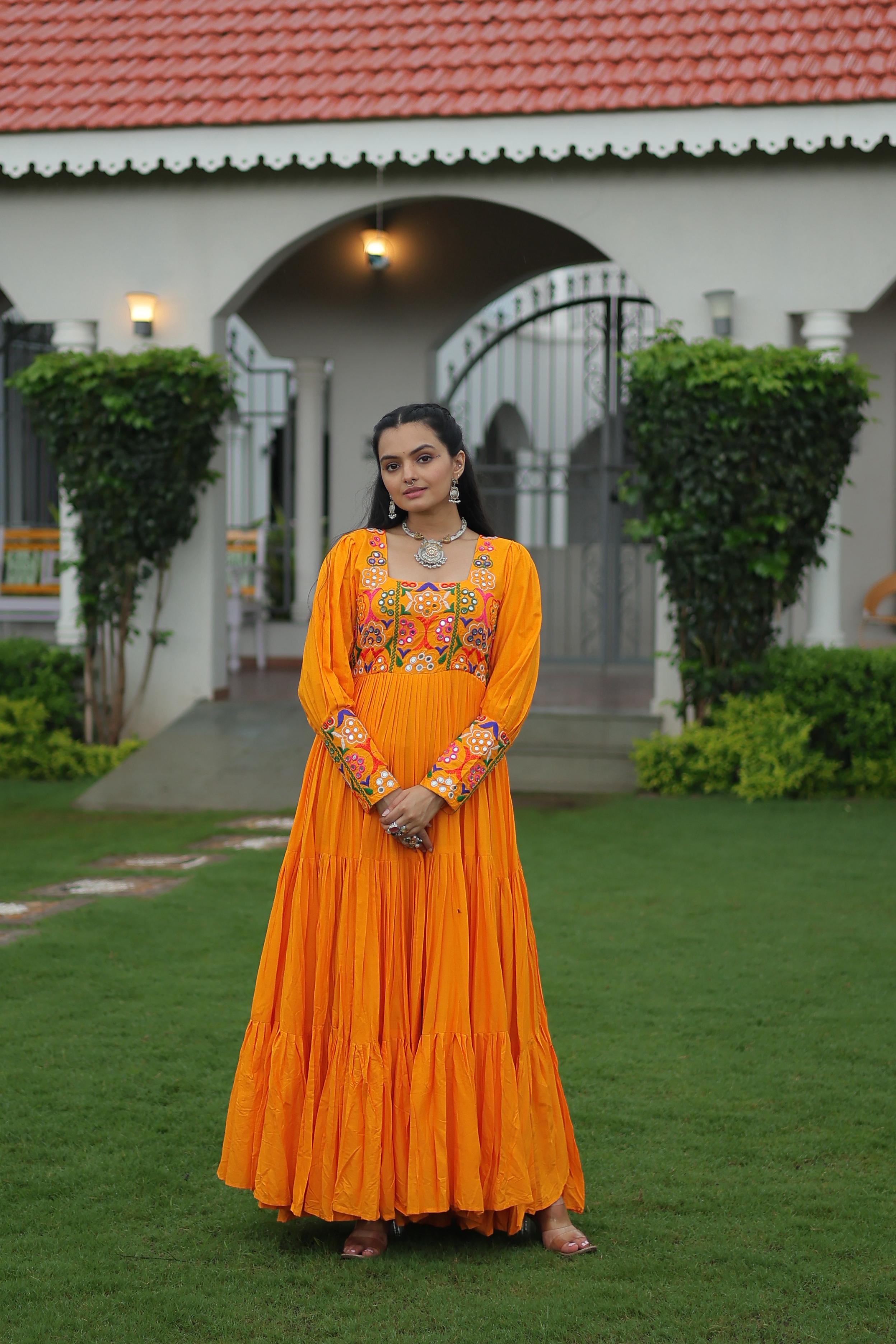 Vibrant yellow gown with Kutchi Gamthi embroidery, perfect for Navaratri celebrations