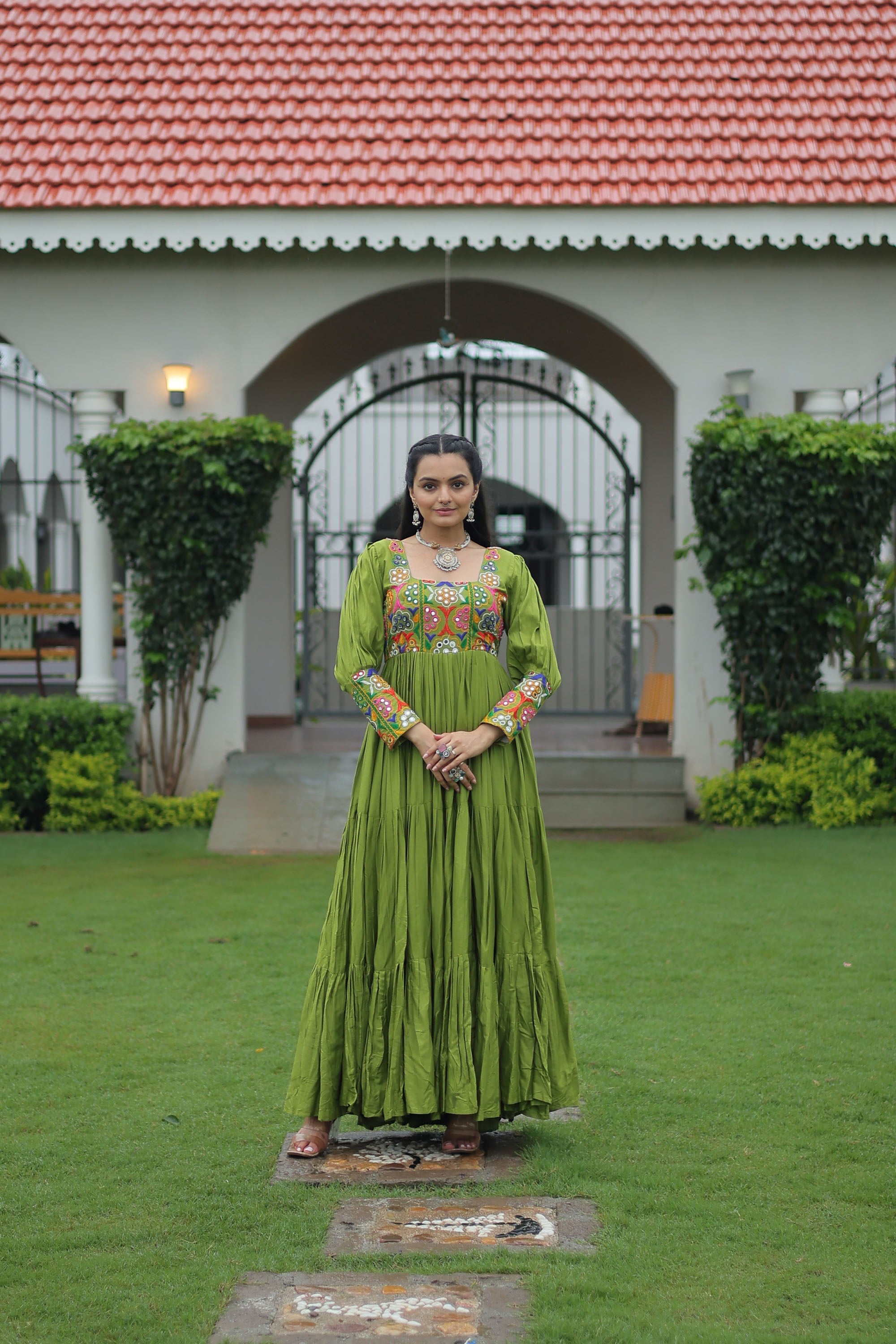 Parot-green rayon gown with 12-meter flair and detailed Kutchi Gamthi embroidery