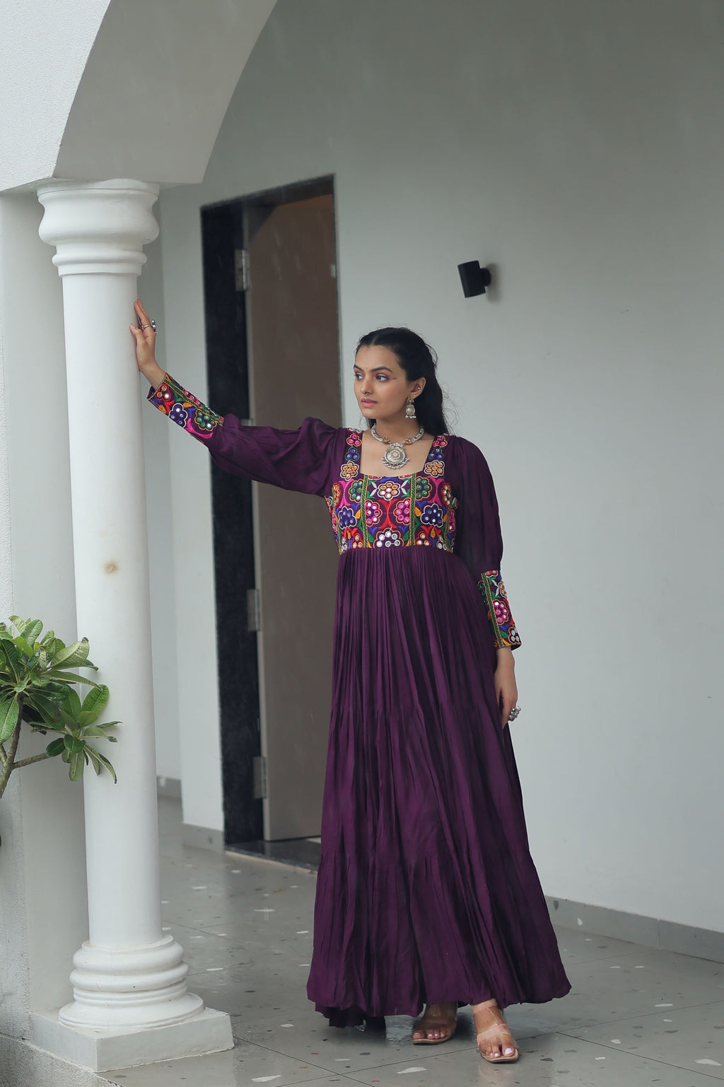 Wine colored rayon gown with traditional Kutchi Gamthi embroidery and wide flare