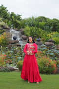 Pink rayon gown featuring intricate Kutchi Gamthi embroidery and cotton print patterns for Navratri