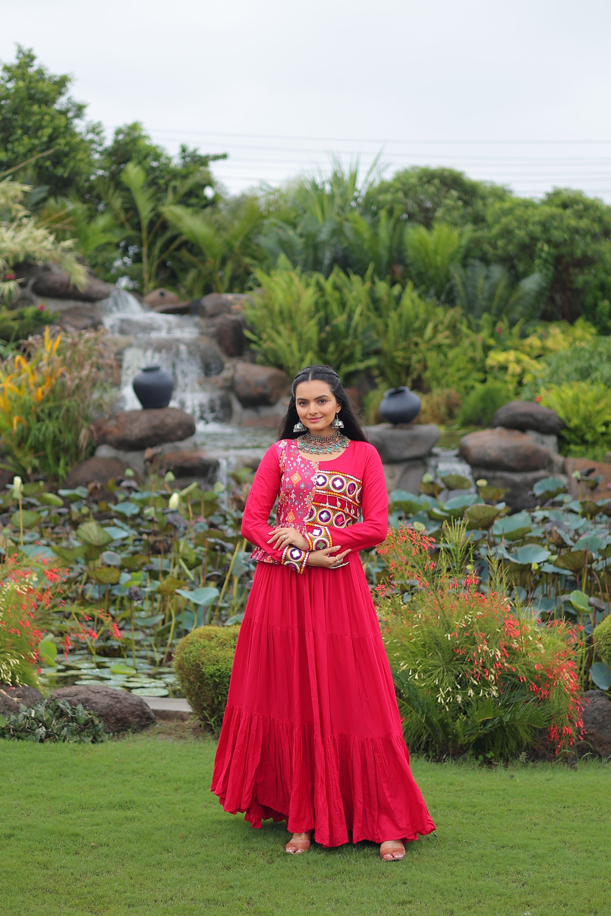 Pink rayon gown featuring intricate Kutchi Gamthi embroidery and cotton print patterns for Navratri