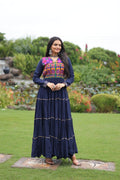 Blue rayon gown featuring traditional Kutchi Gamthi embroidery and mirror work