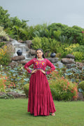 Maroon rayon ethnic gown with Kutchi Gamthi embroidery and a wide 10-meter flare.
