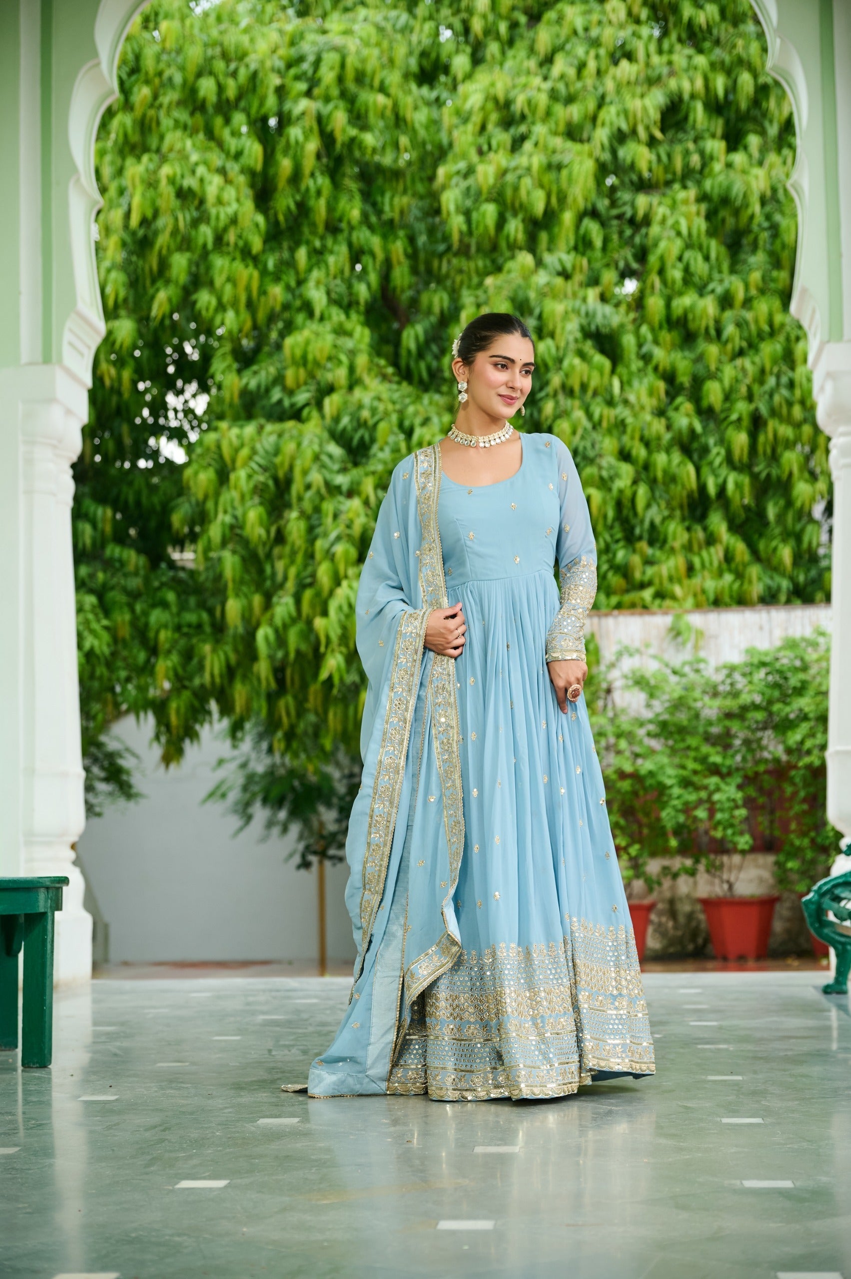 Light lavender faux georgette gown with intricate embroidery and matching dupatta