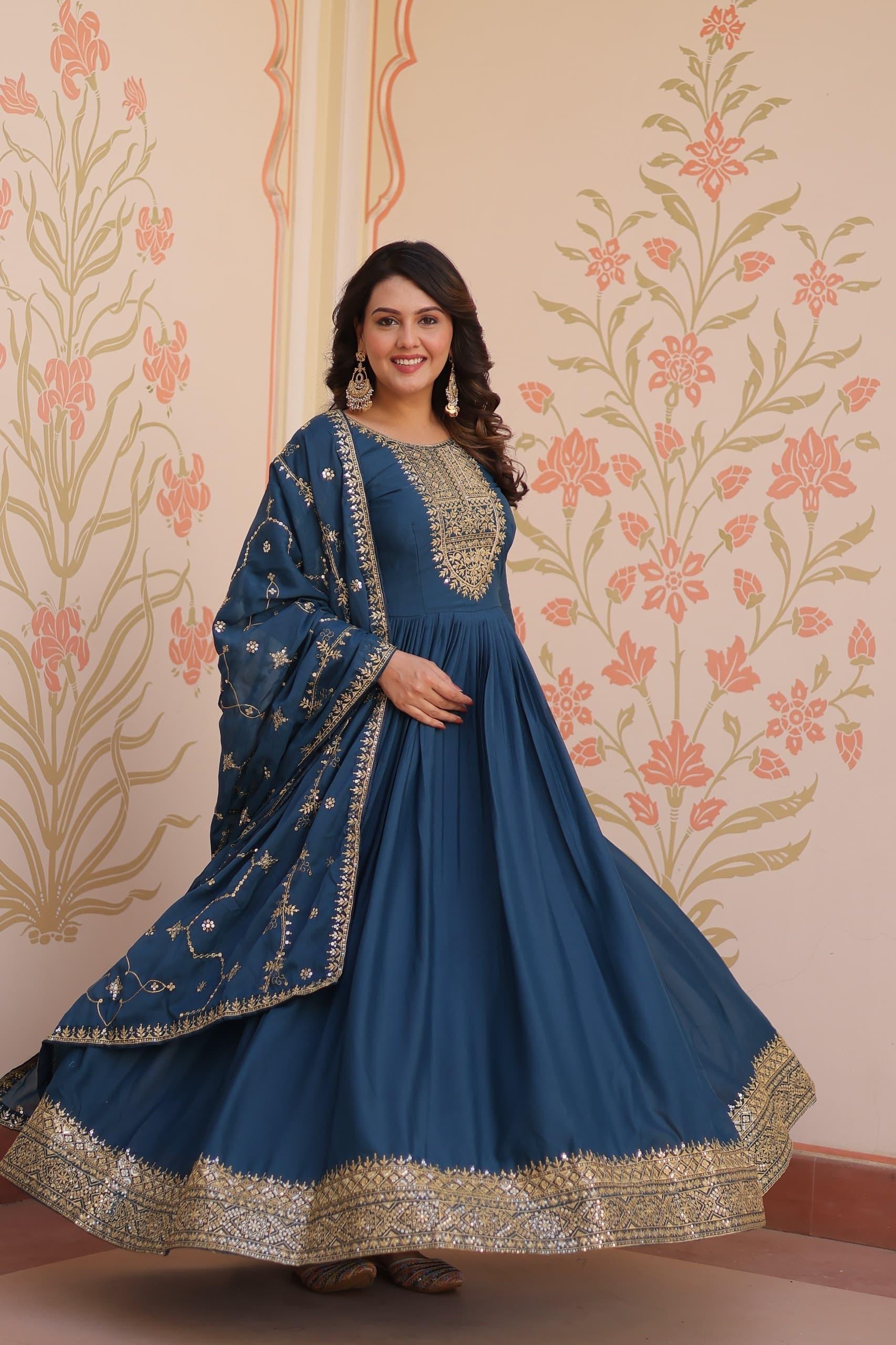Rama colored georgette gown with gold zari and sequins embroidery and matching dupatta