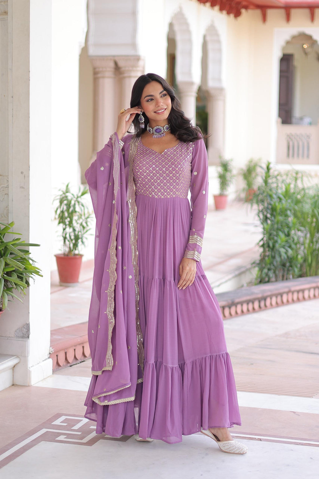 Onion pink faux georgette gown with heavy sequins and zari embroidery details