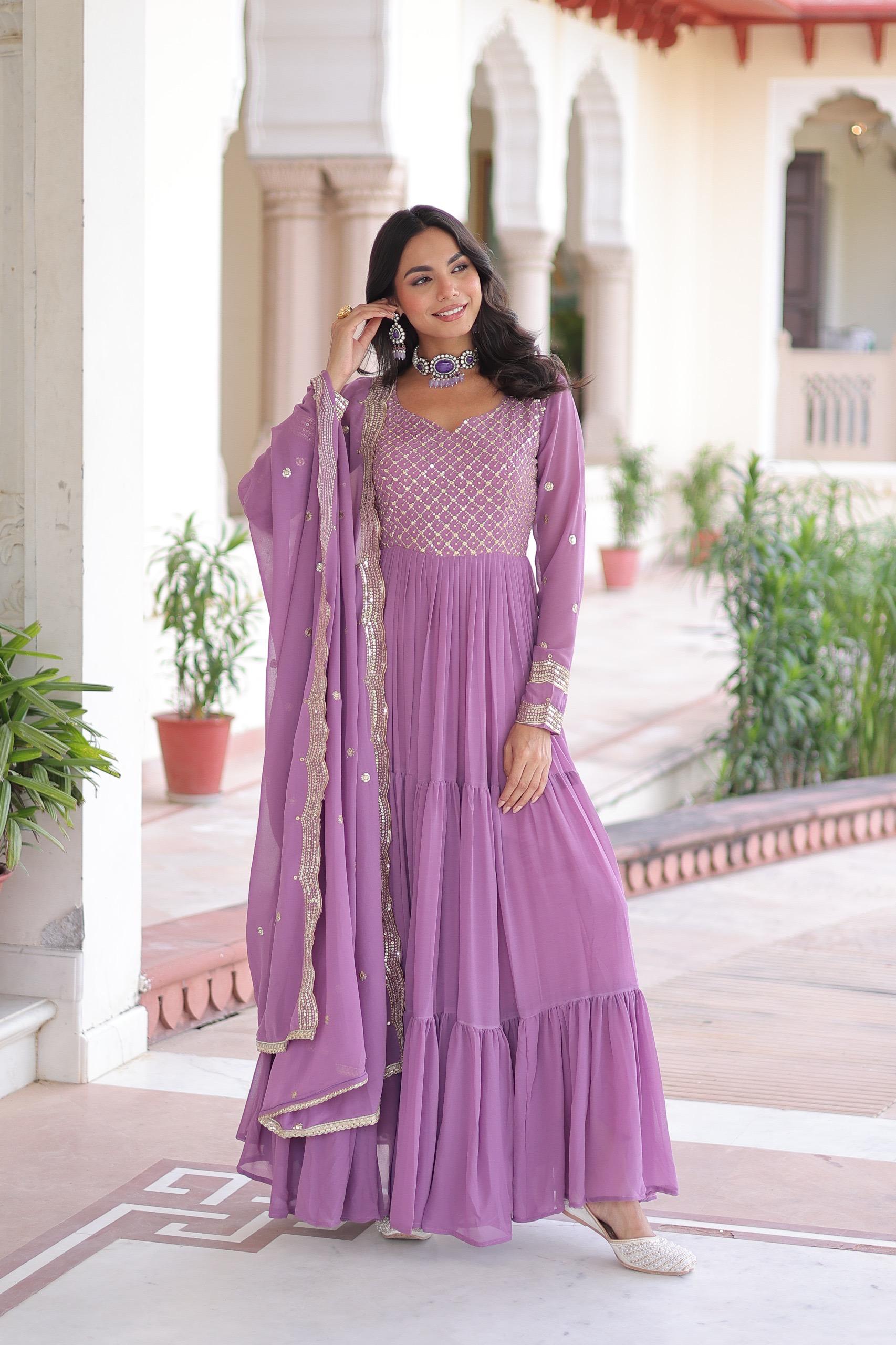 Onion pink faux georgette gown with heavy sequins and zari embroidery details