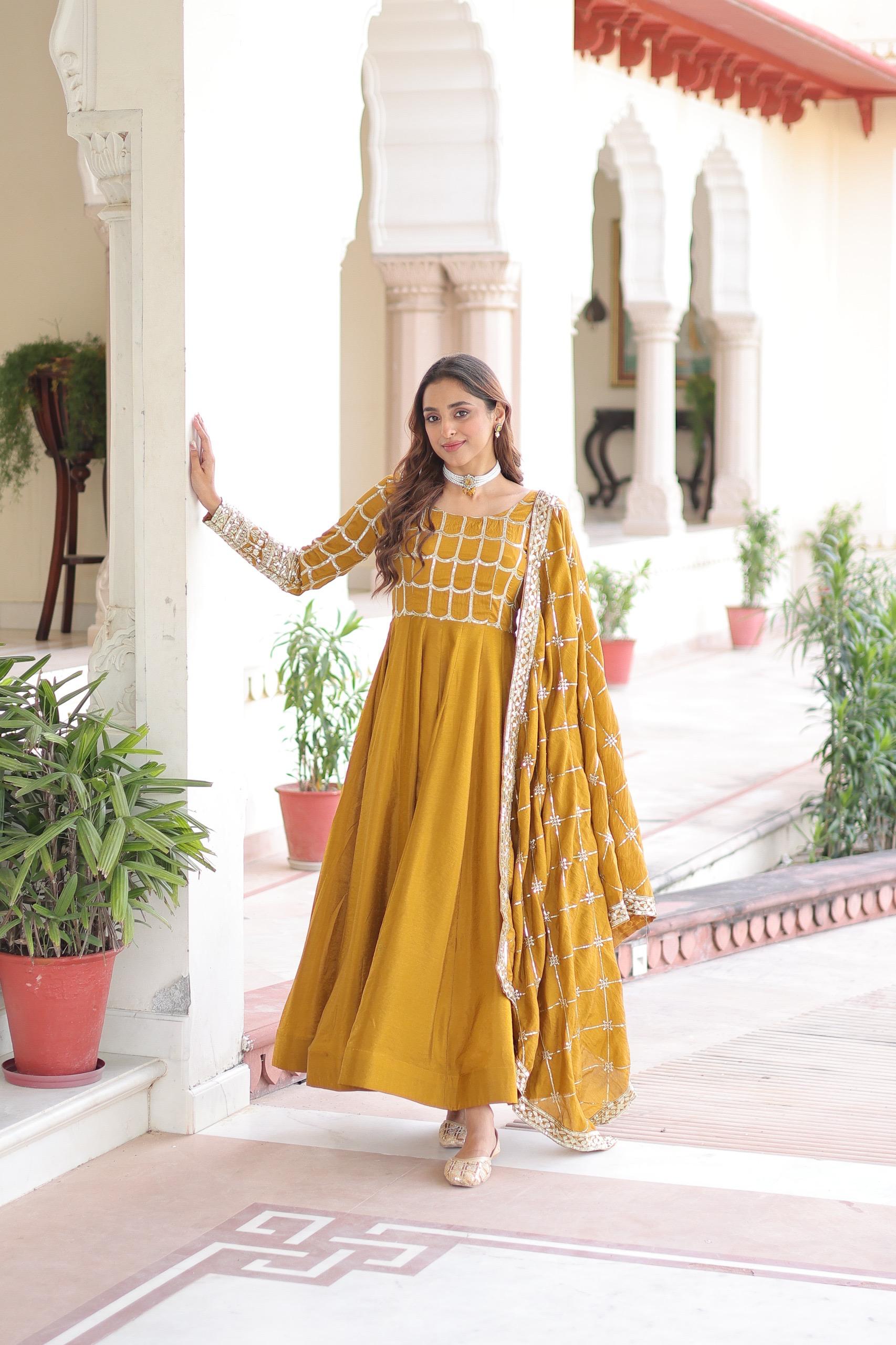 Prazu Fashion Mustard Vichitra Silk Rich Sequins & Zari Embroidered Gown With Dupatta