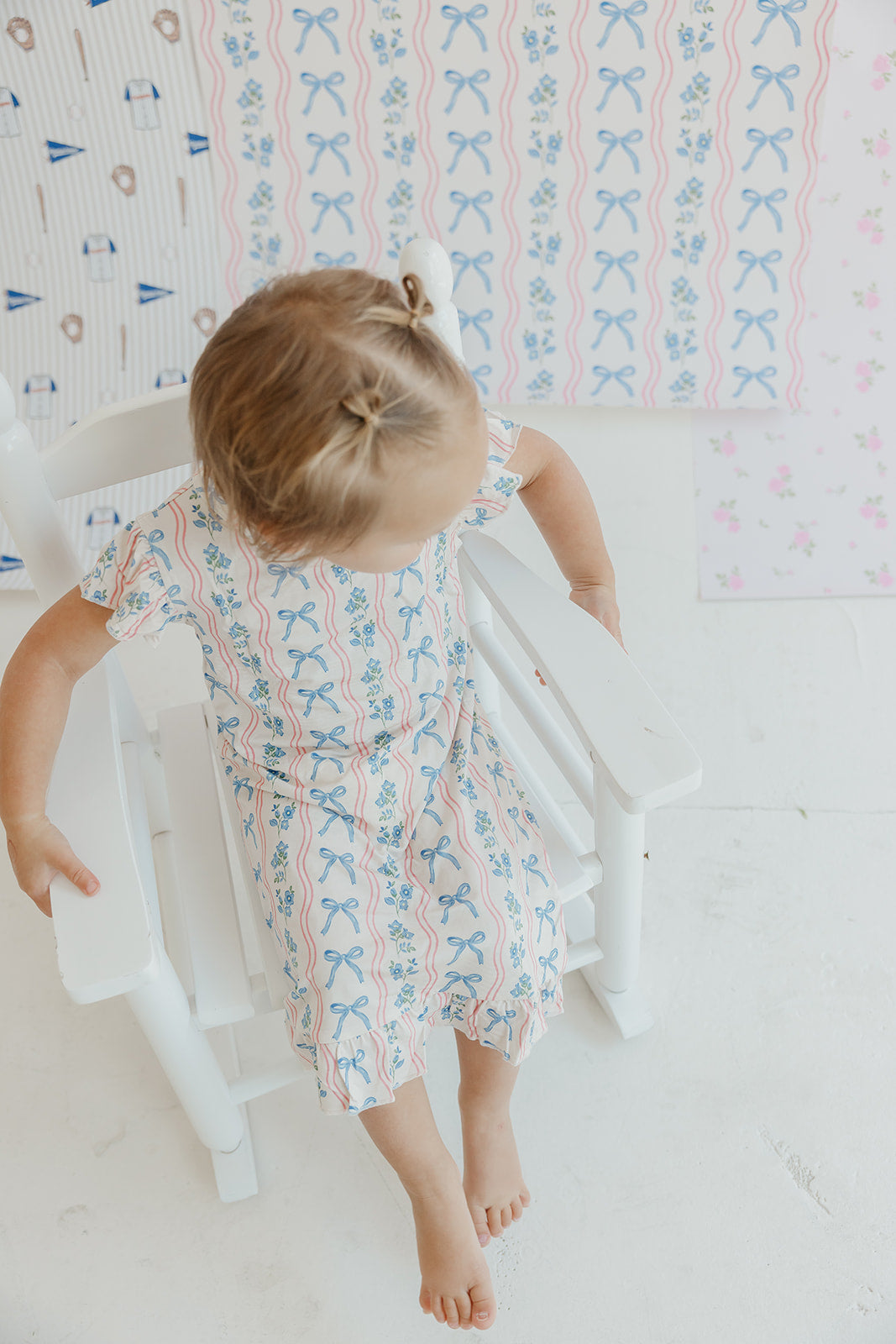 Amelia Bow Whimsical Nursery Wallpaper in Pink and Blue