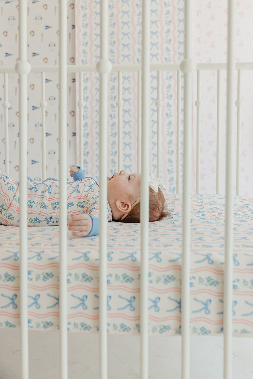 Amelia Bow Whimsical Nursery Wallpaper in Pink and Blue