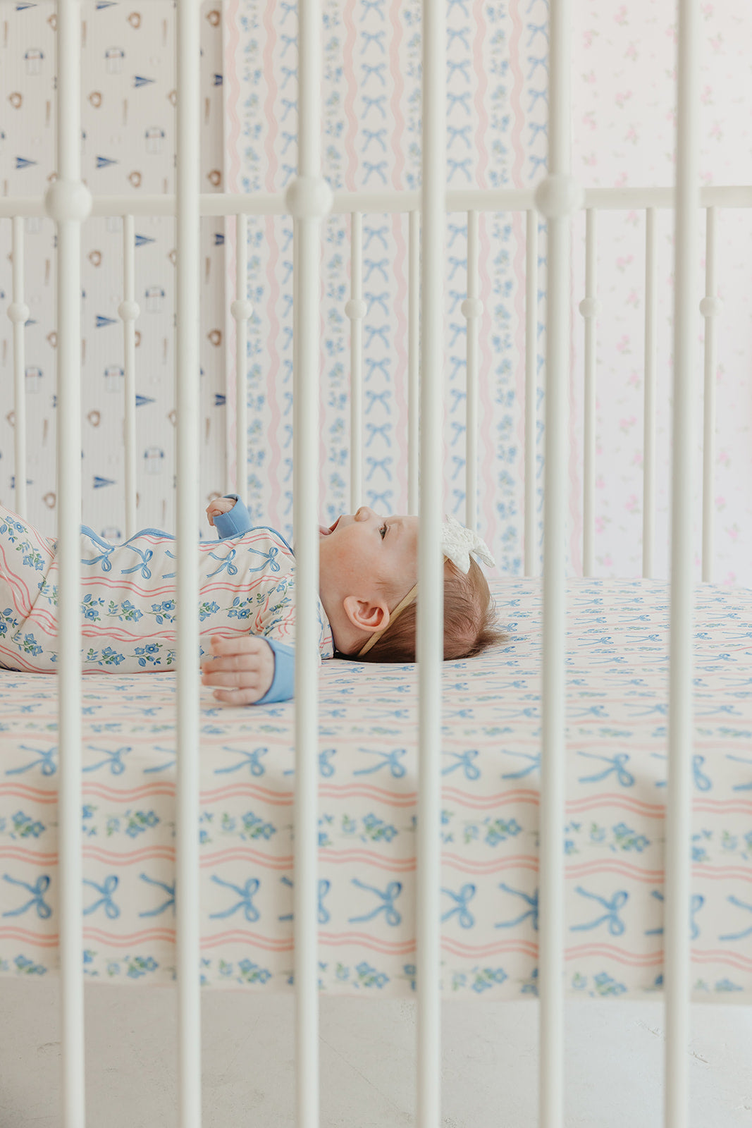 Amelia Bow Whimsical Nursery Wallpaper in Pink and Blue