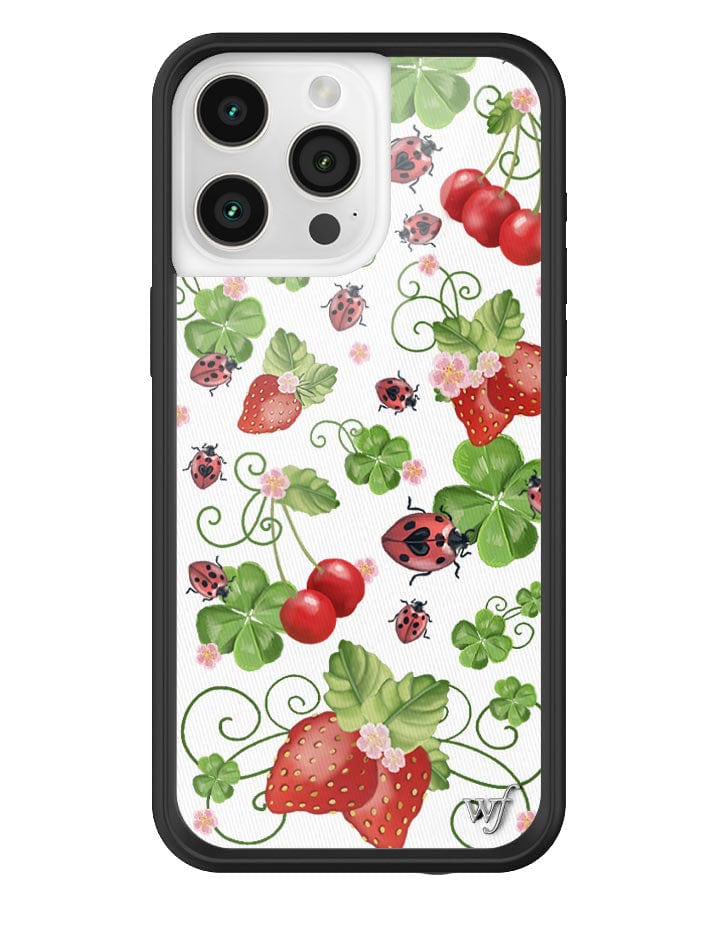Bugs n' Berries iPhone case featuring a white background with strawberries, cherries, green leaves, and red ladybugs.