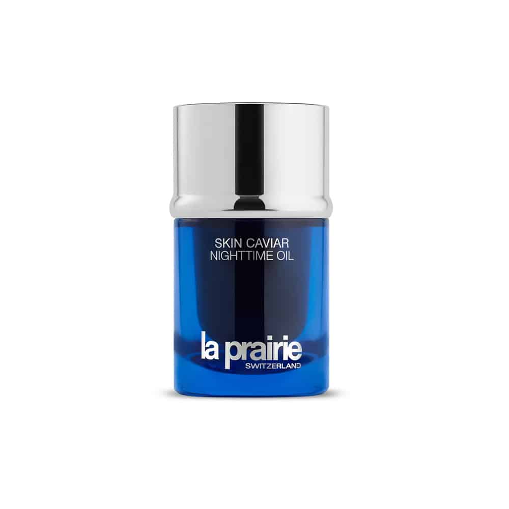 La Prairie Skin Caviar Nighttime Oil in a deep cobalt blue bottle with silver accents.
