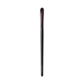 Close up of a black and brown rounded synthetic crème eye color makeup brush.