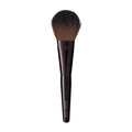 Sculpted makeup brush designed for applying loose setting powder.
