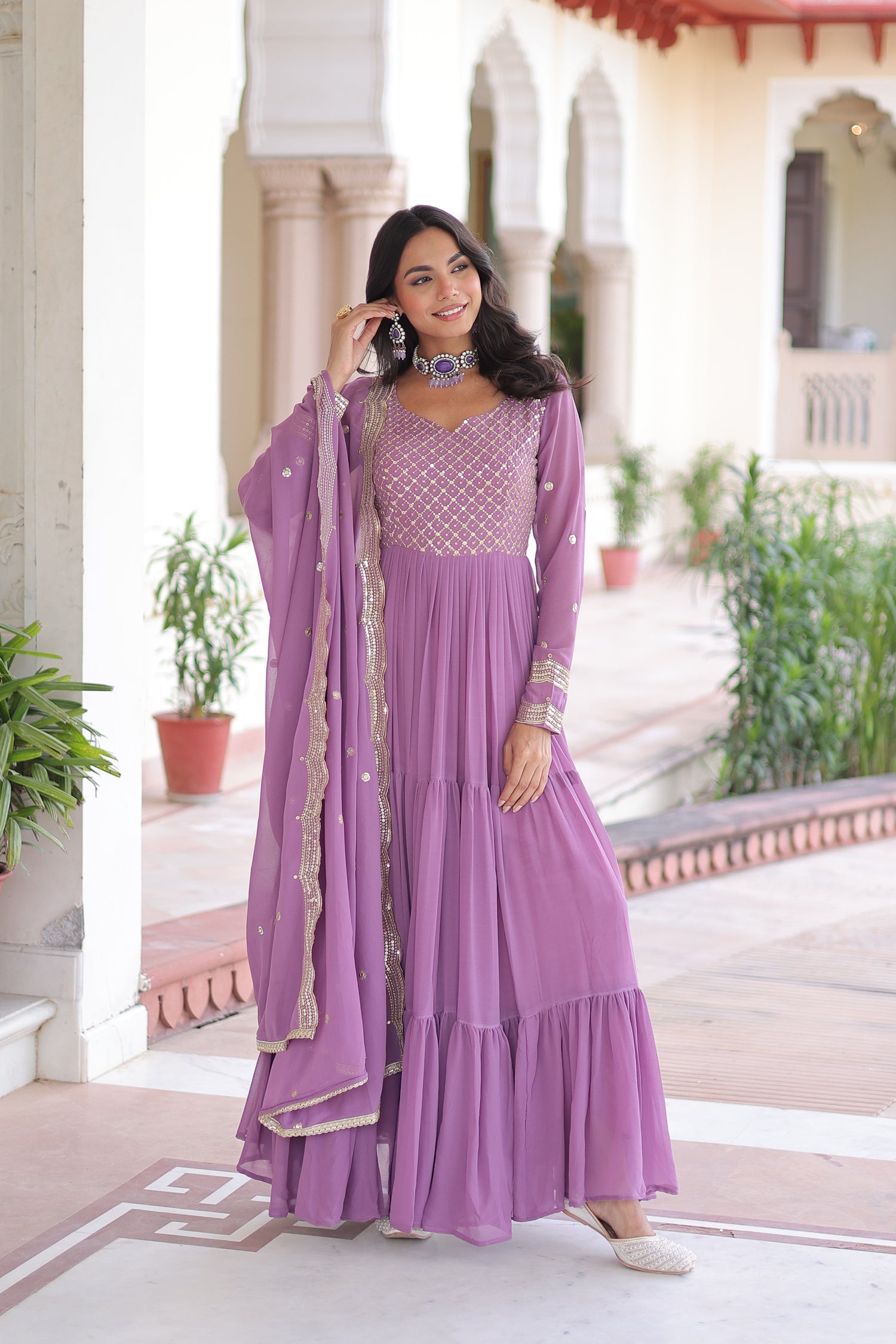 Lavender Faux Georgette Anarkali Gown adorned with intricate Zari and sequins embroidery