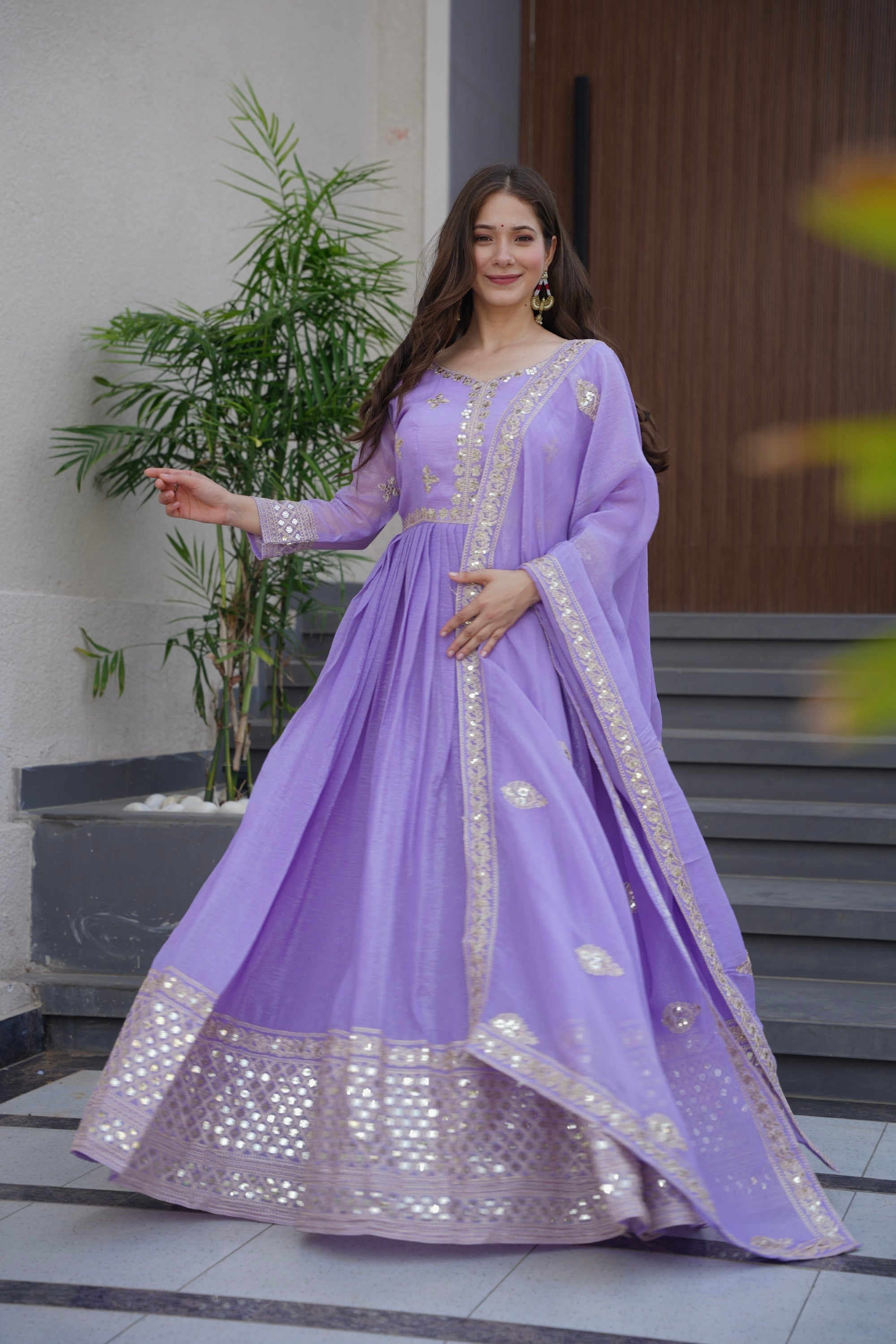 Front view of a Lavender Crunchy Silk Anarkali Gown with detailed embroidery and sequins work, including a matching dupatta.