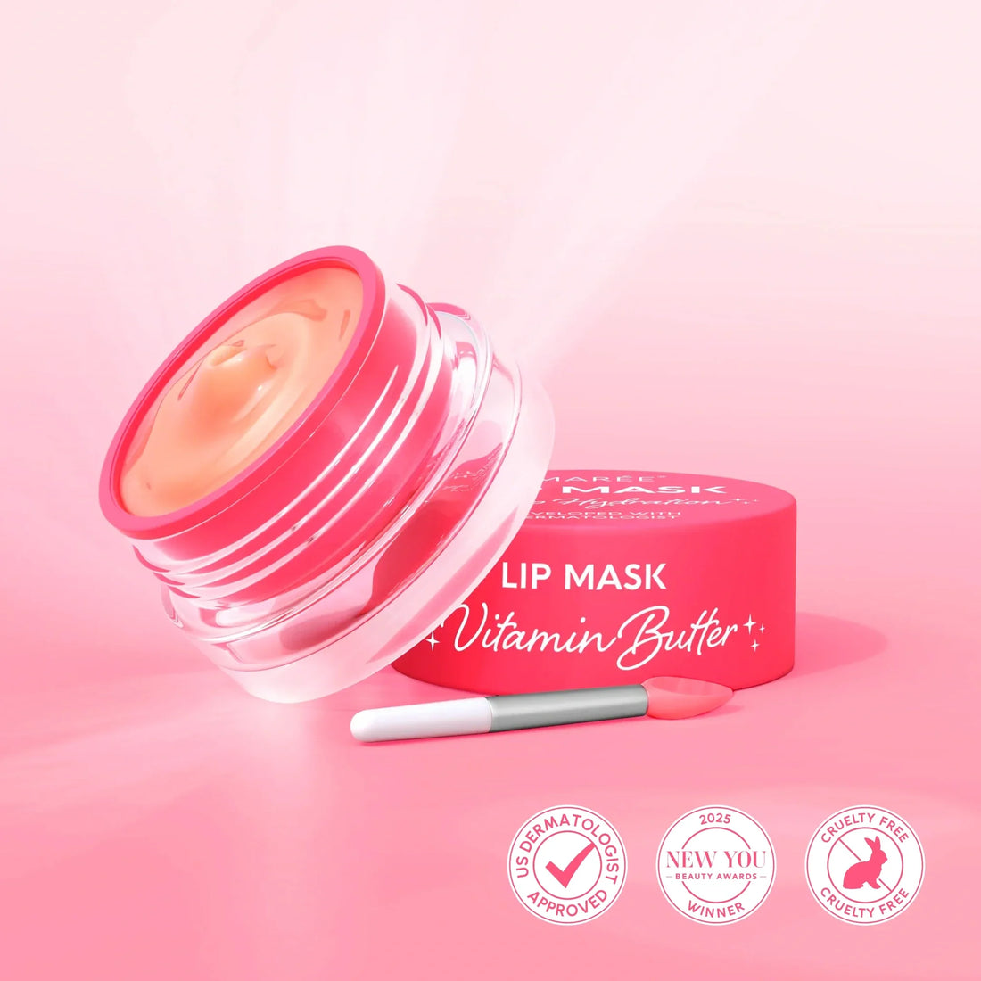 Maree overnight lip mask in a pink jar with an applicator brush on a pink background