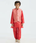 A boys' tomato red kurta pajama set featuring a matching sequin Nehru jacket, perfect for festive occasions.