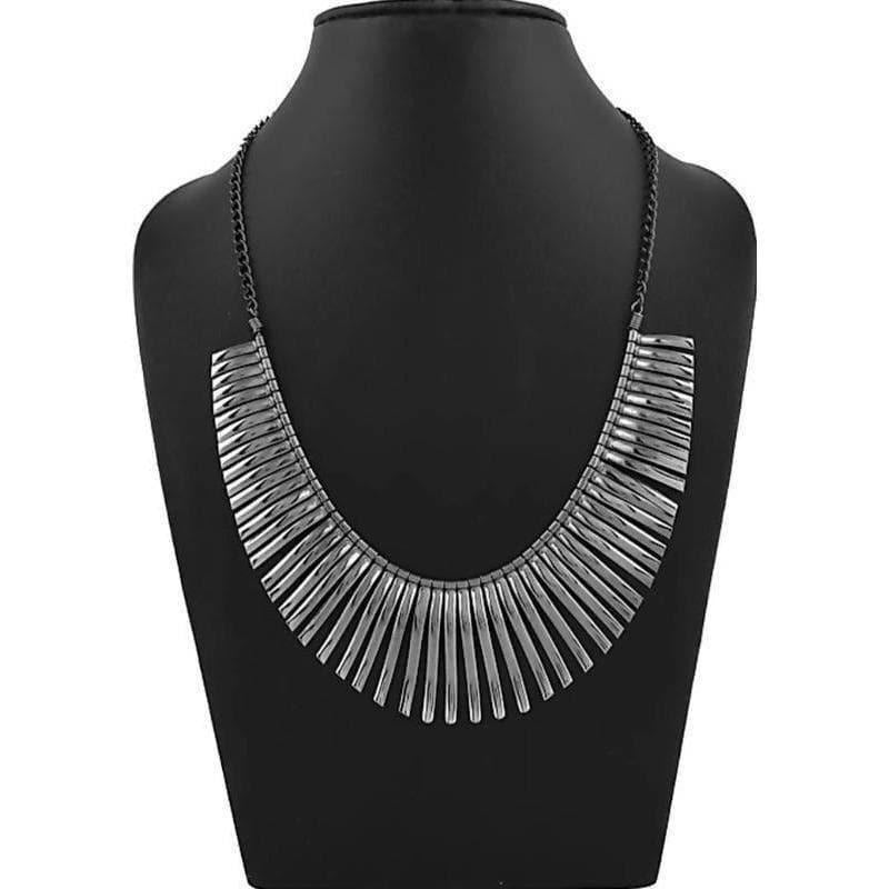 Close-up of a stylish silver-tone designer necklace on a neutral background