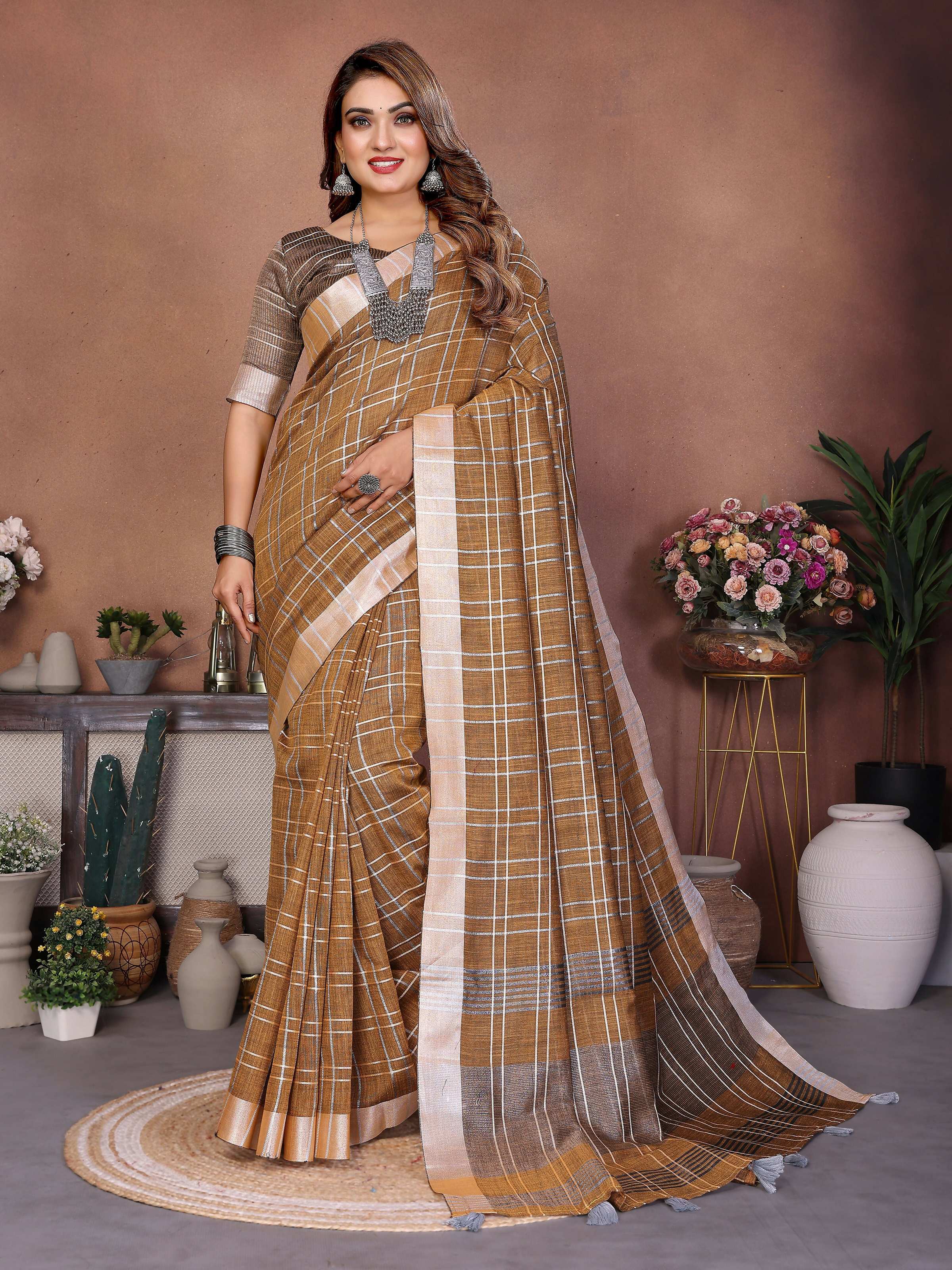 Mustard color linen saree with traditional weaving patterns draped elegantly