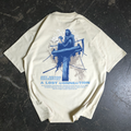 Back of an oversized bone-colored t-shirt with a grim reaper graphic sitting on a telephone pole and text about lost connections.