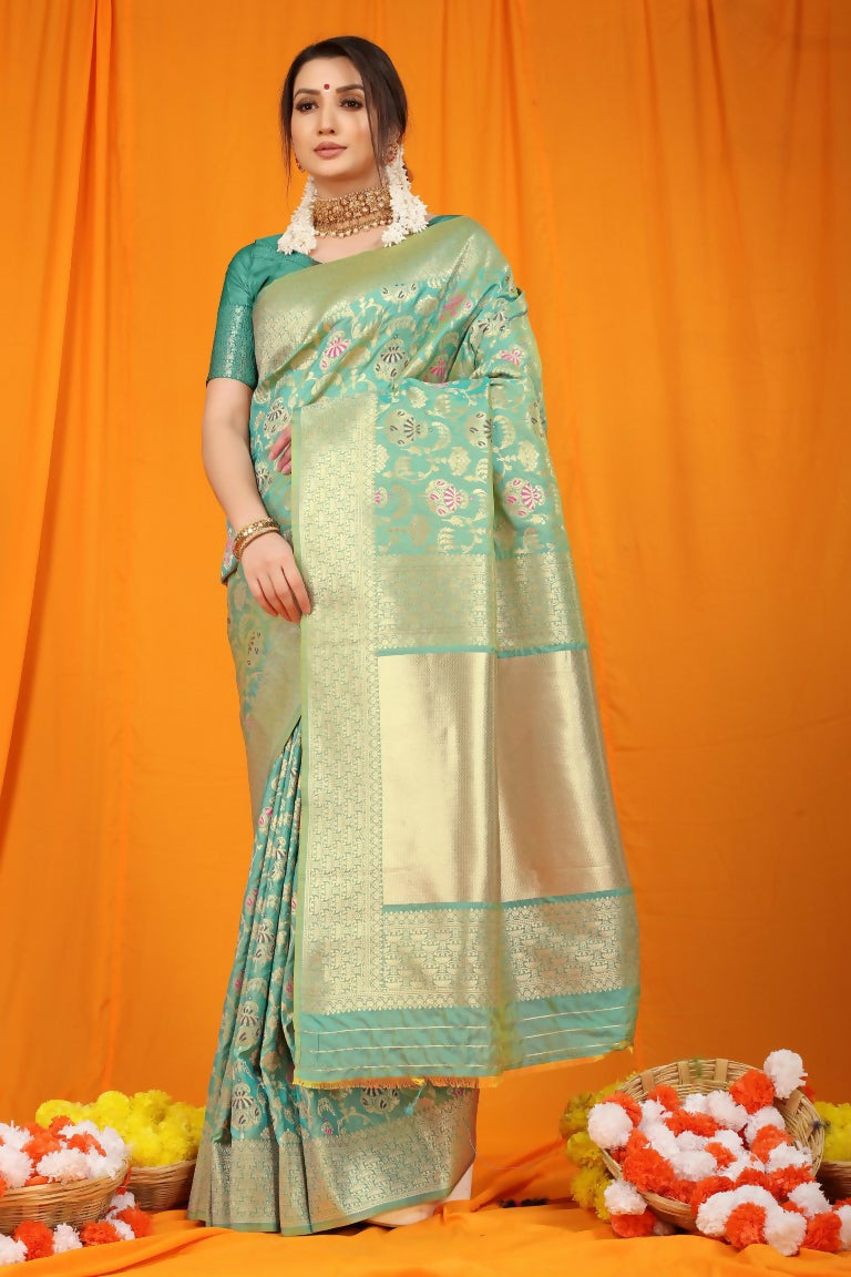 Sea green Kanjivaram silk saree featuring Zari woven details and a matching blouse.