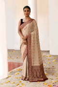 Crème colored pure handloom Banarasi silk saree in crepe chiffon fabric.