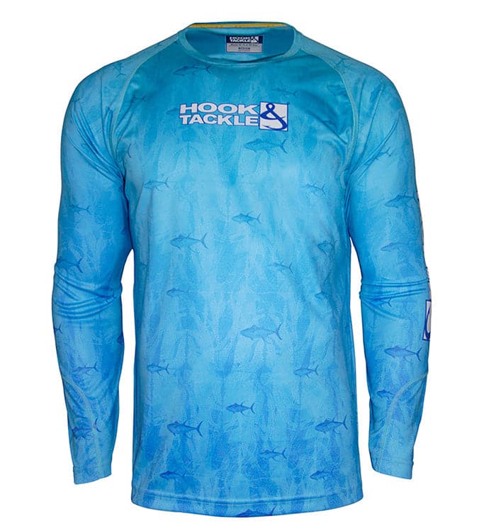 Man wearing a blue long sleeve fishing shirt with a tuna print pattern