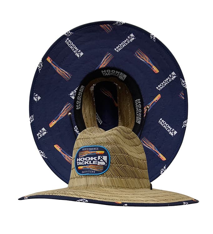 A straw lifeguard hat featuring a blue underside with a marlin lure print and an adjustable chin strap.