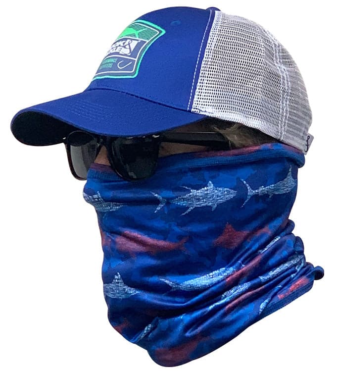 A person wearing a blue fish-patterned neck gaiter for UV protection while fishing.