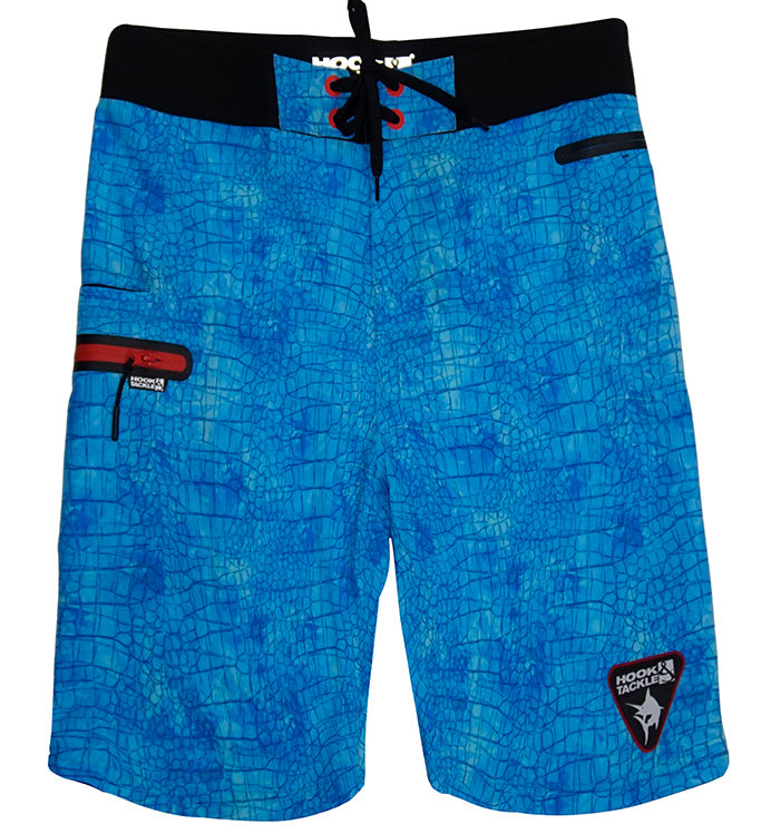 Men wearing bright blue Chaos stretch fishing boardshorts with a croc-skin pattern and zippered pockets.