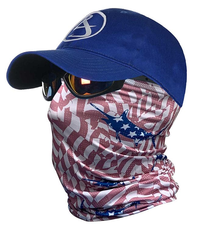 A person wearing a blue baseball cap and a red, white, and blue stars and stripes patterned neck gaiter over their face.