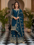 A beautiful teal silk embroidered kurti paired with a sharara.