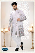 A white silk men's kurta set featuring intricate thread and sequence embroidery in a straight cut design.