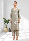Gray long linen kurta with elegant embroidery and V-neck paired with matching pants.