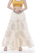 Young girl wearing an off-white cotton sharara with detailed Gota work and string closure.
