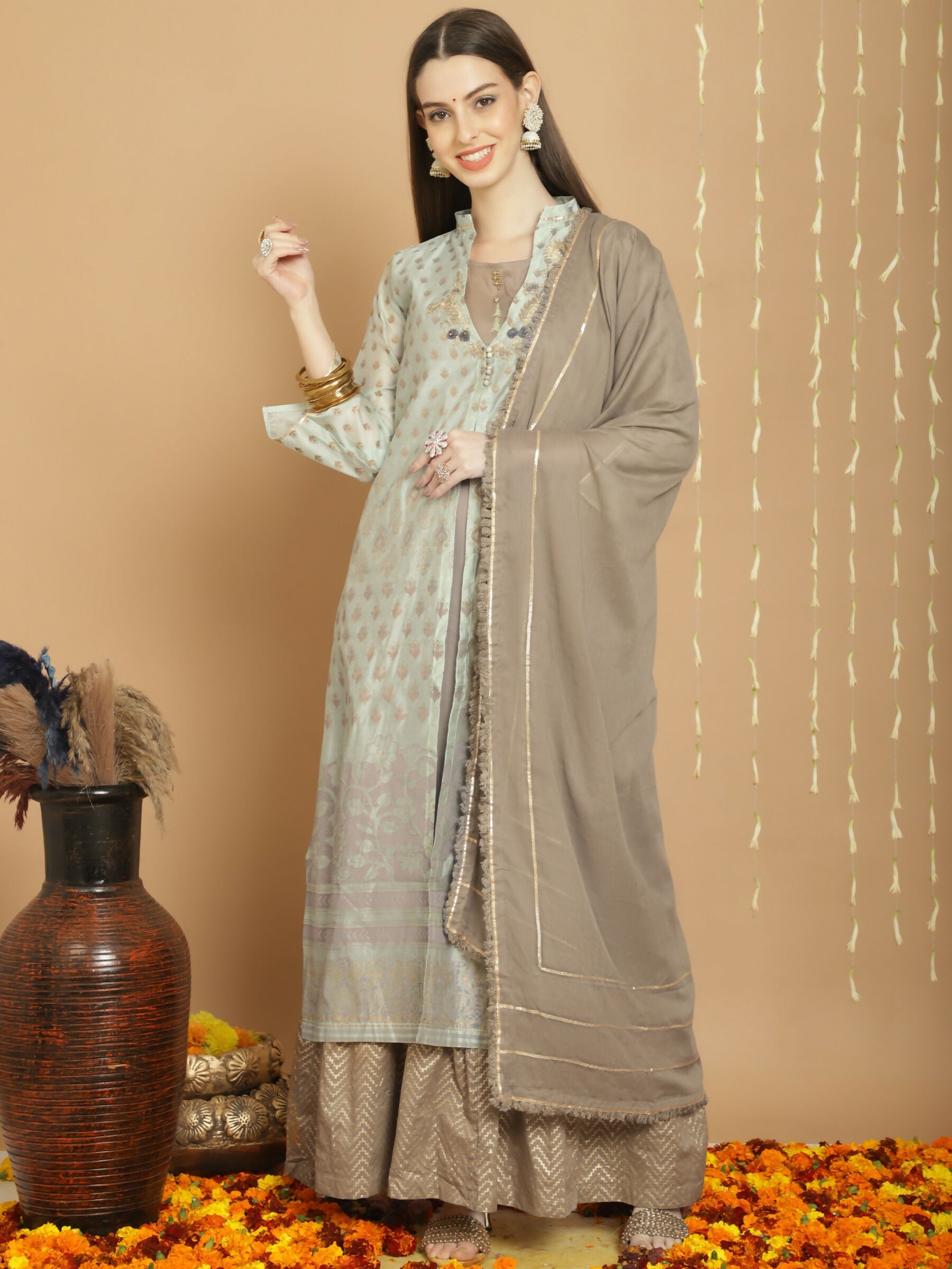 Elegant Green Chanderi Silk A-Line kurta with Jardoshi embroidery paired with cotton palazzo pants.