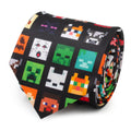 A close up view of a black necktie featuring a repeating pattern of various pixelated Minecraft characters and items.