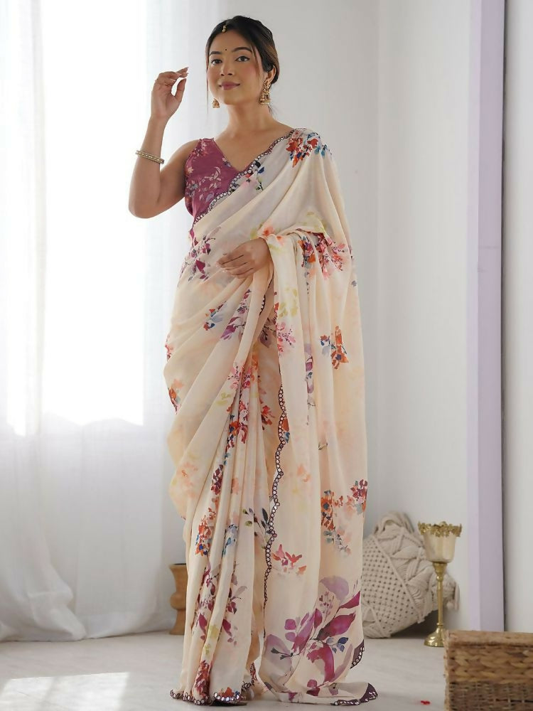 Cream georgette saree featuring colorful digital print and subtle mirror work.