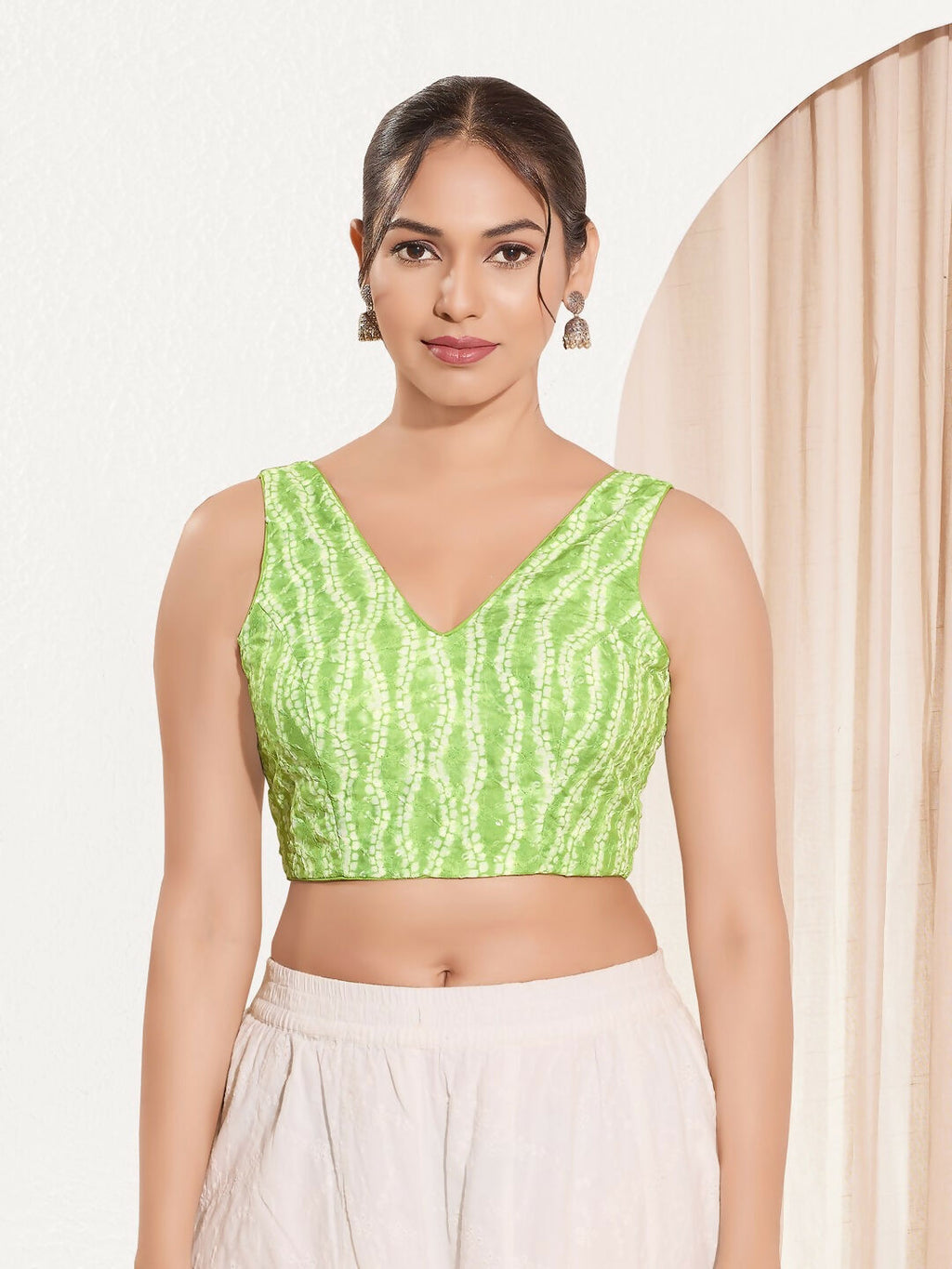 Pista Green sleeveless V-neck padded blouse in Viscose Rayon fabric